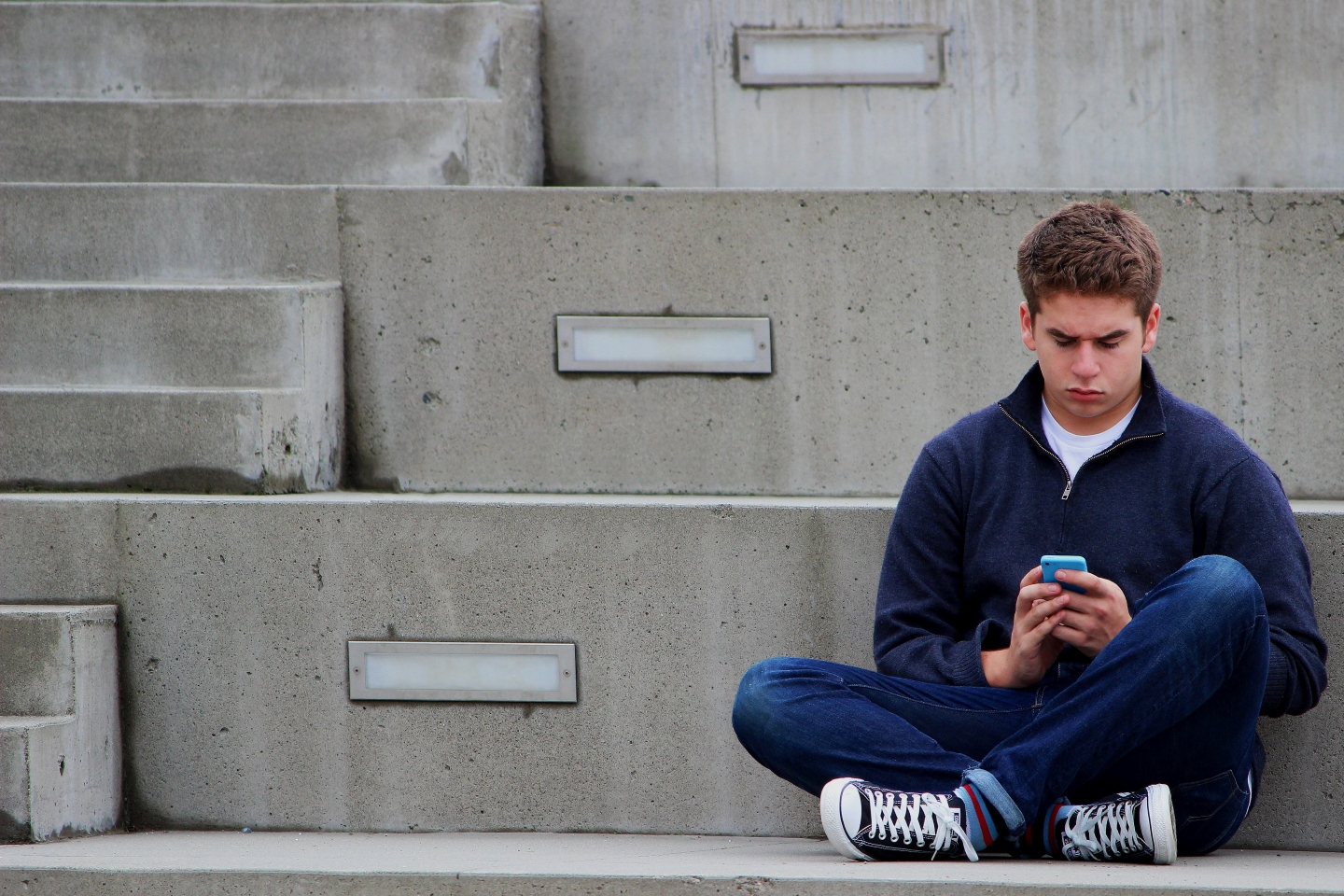 Teen boy texting