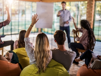 Group of people with their hand up