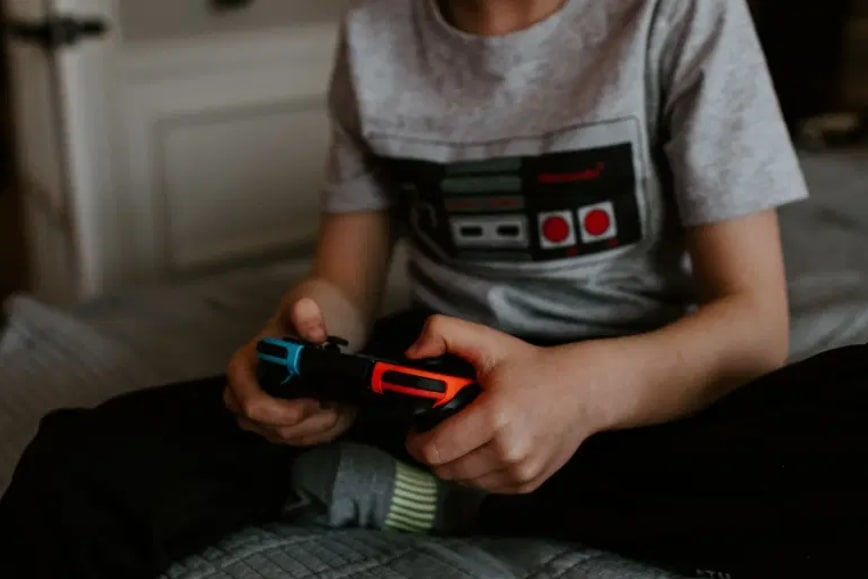 Boy gaming with controller