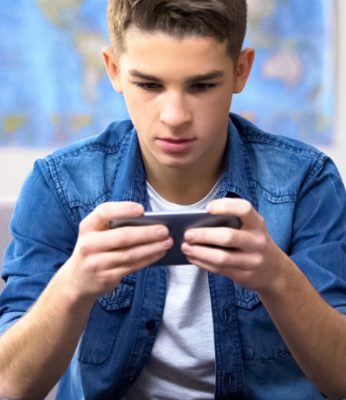 Boy playing a game on a device